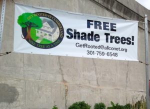 a picture of a banner saying "FREE Shade Trees!" with contact information