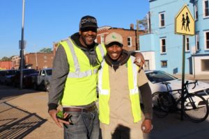 Two tree planting workers in the Baltimore Tree Trust Urban Roots Apprenticeship Program.